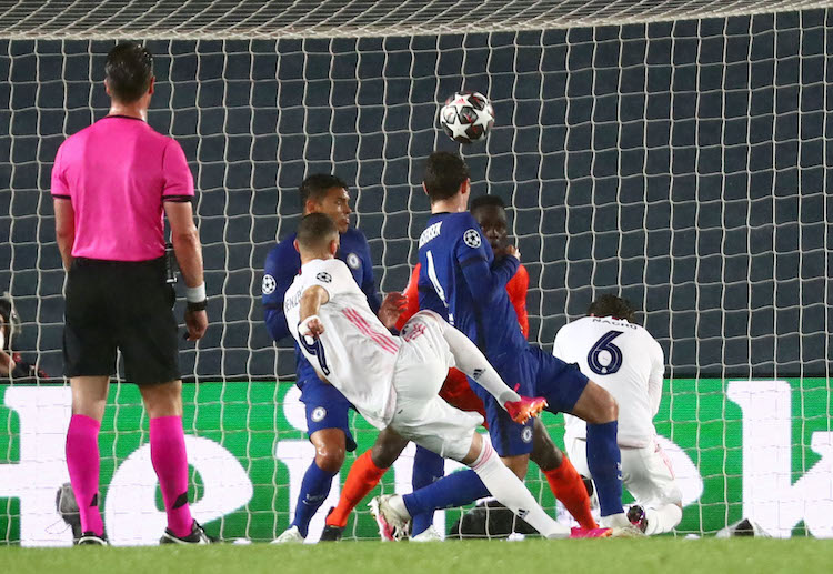 Karim Benzema scores in the 29th minute to help Real Madrid draw level with Chelsea during their Champions League clash