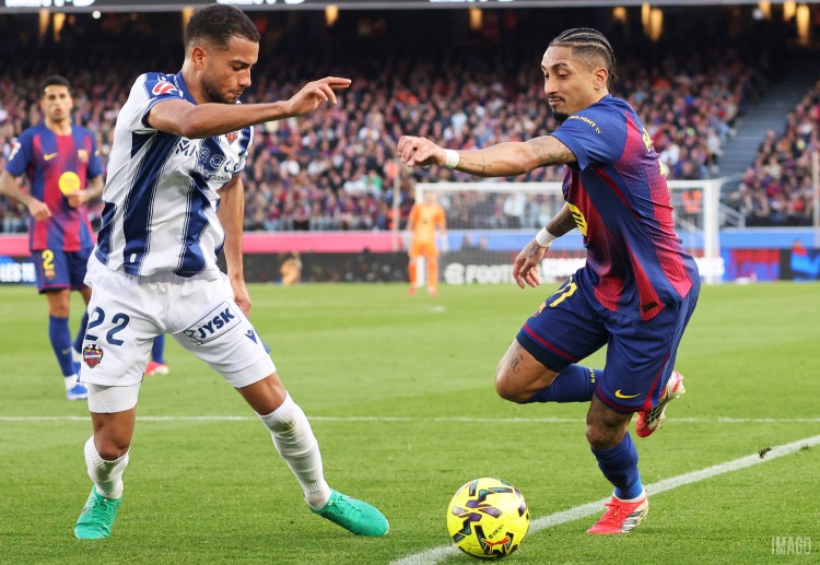 FC Barcelona’s Raphinha contests the ball with Levante’s Jeremy Toljan in a tense La Liga fixture